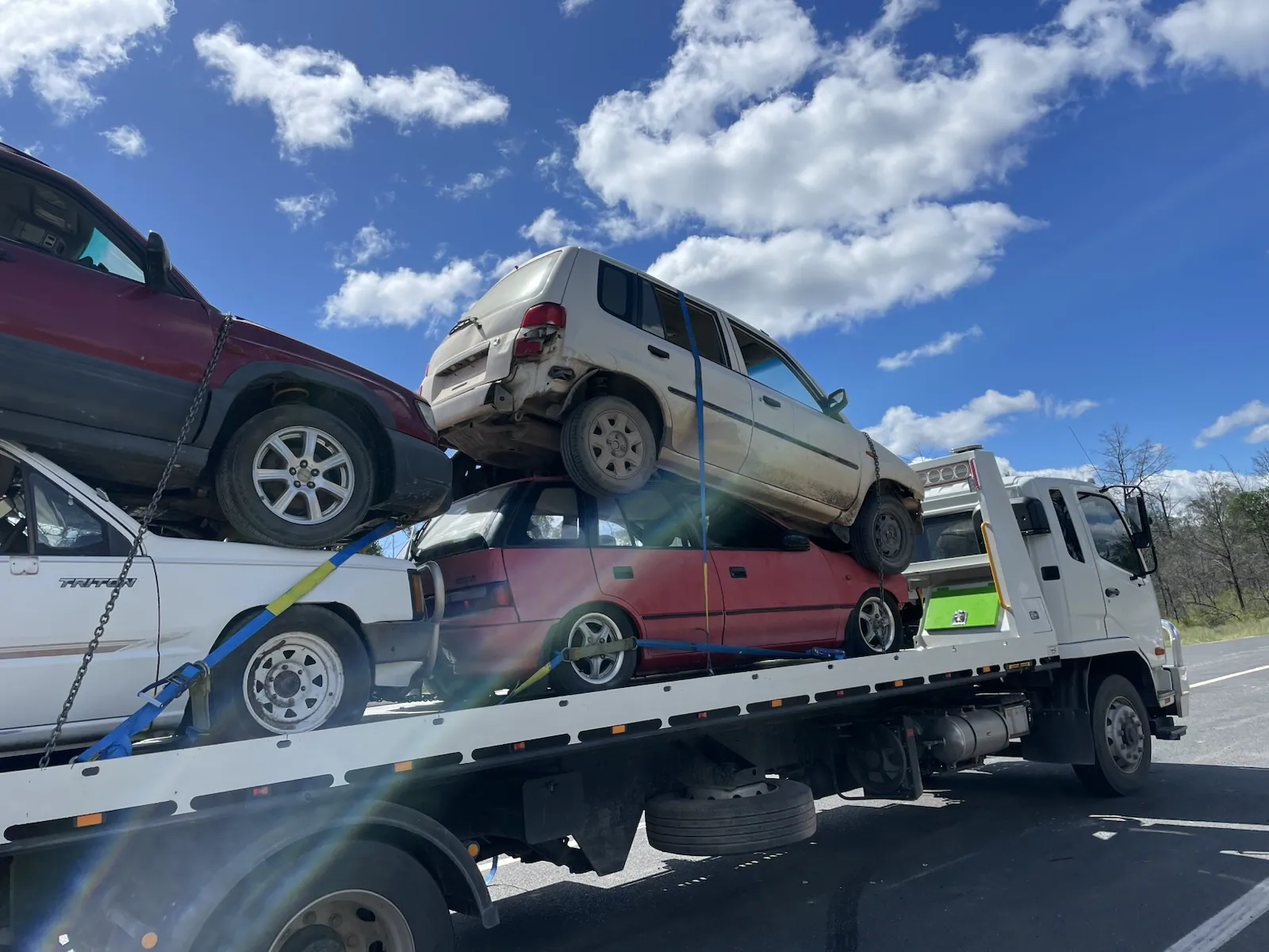 Multiple unwanted vehicles loaded on a car carrier