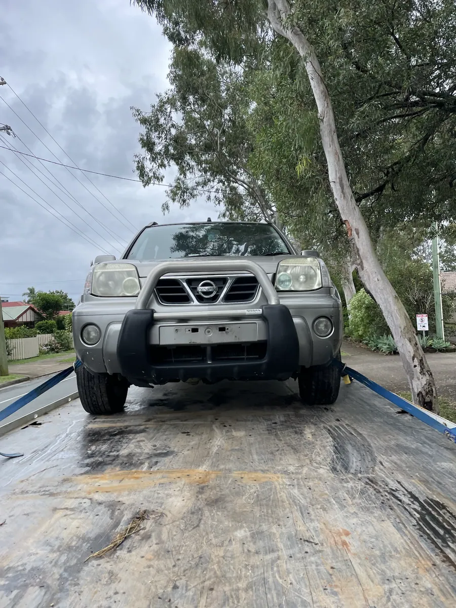 Nissan four wheel drive on a tilt tray for removal