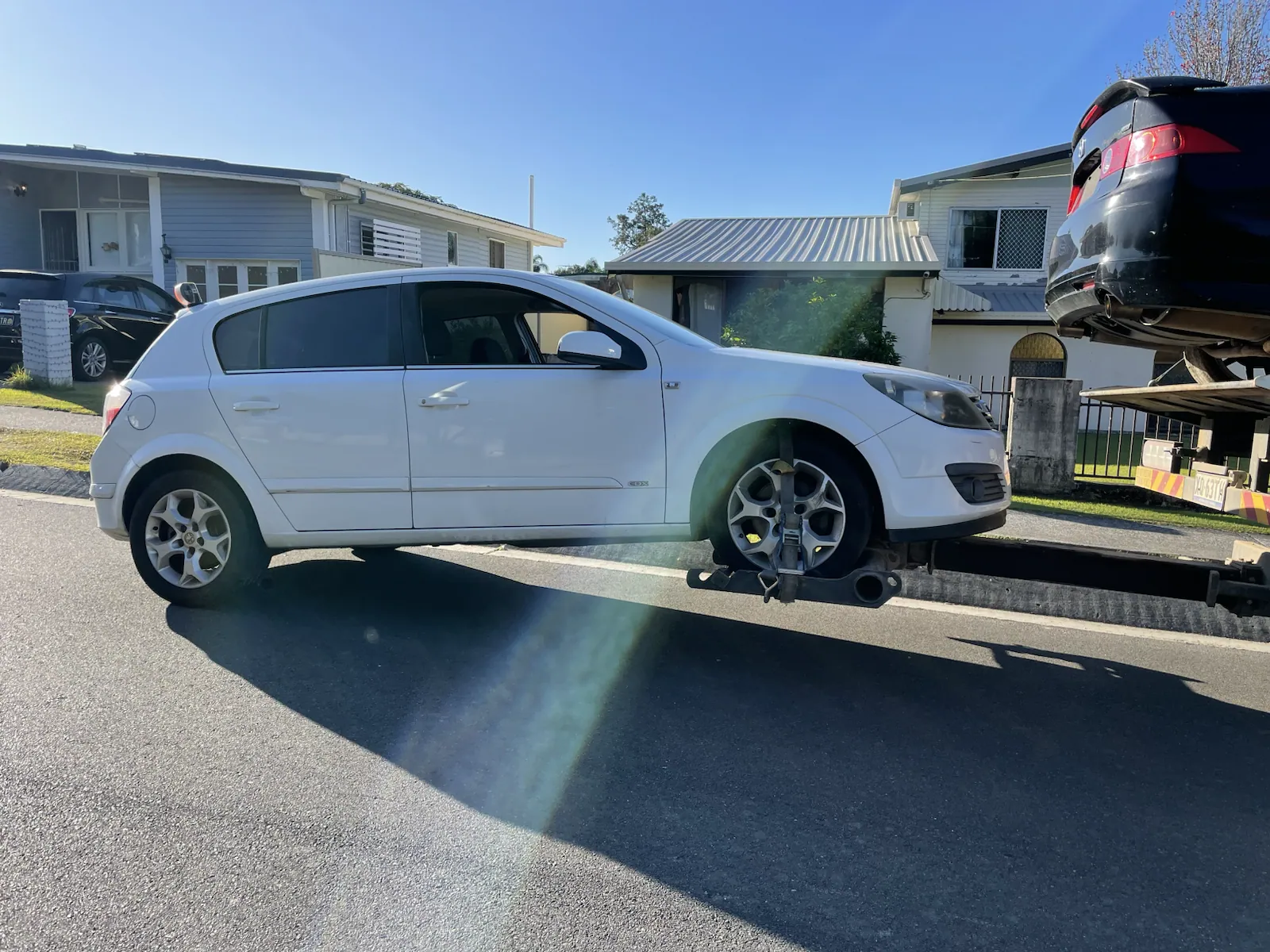 White wagon loaded for vehicle removal in Queensland