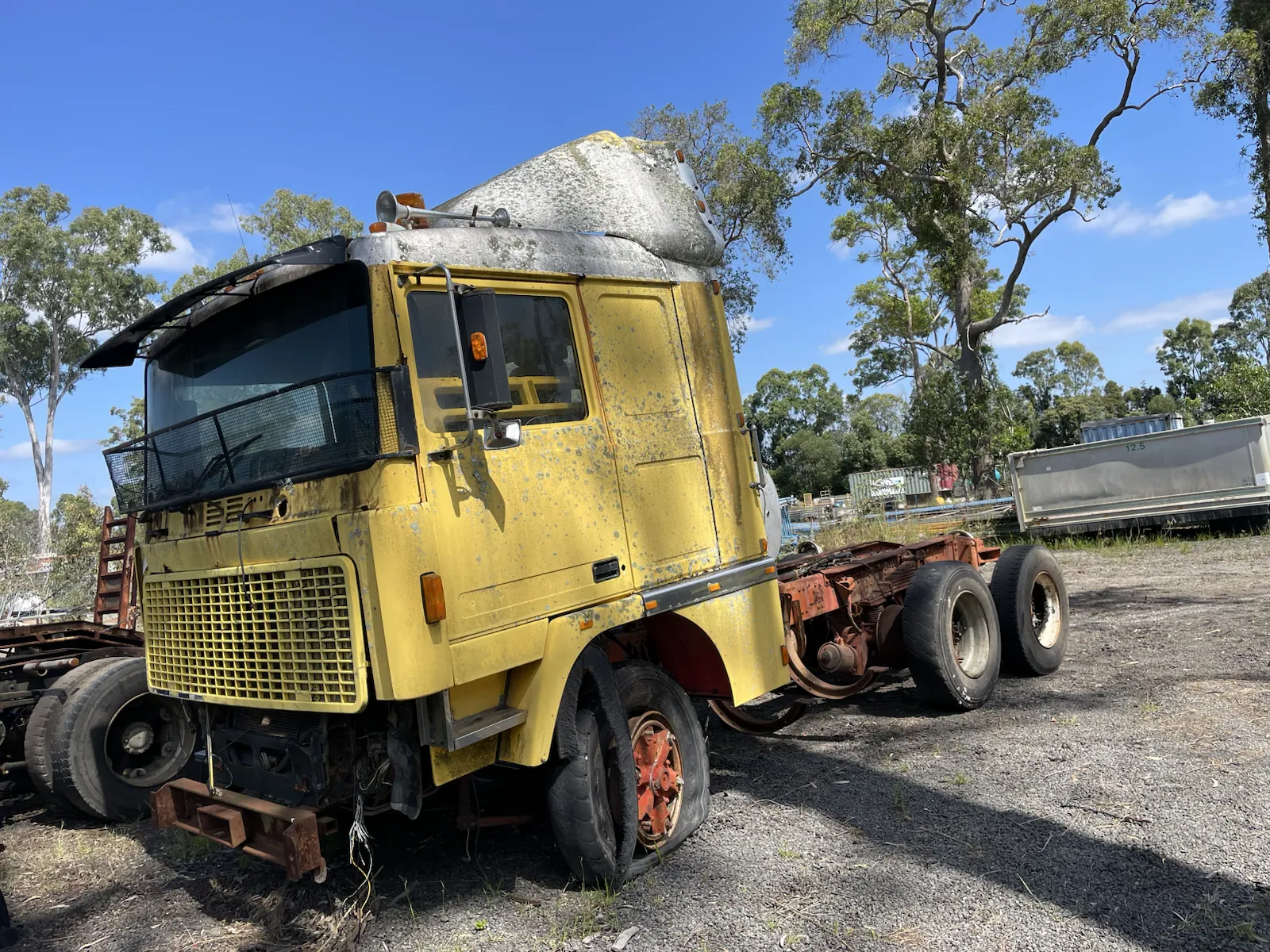 Yellow prime mover collected for truck scrap removal